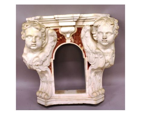 A superb rare 16th-17th century Italian carved two-colour marble niche, each side with a carved wing cupid and acanthus aside