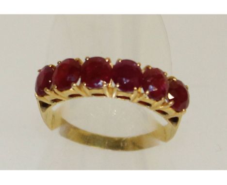 A 22ct gold six stone ruby ring.