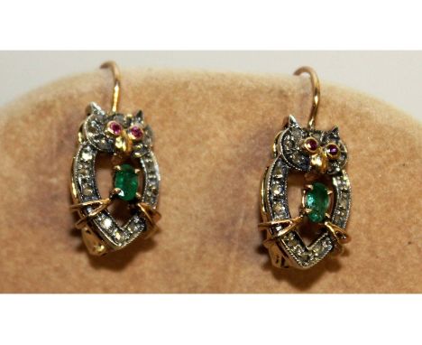 A pair of diamond, emerald and ruby oval earrings, set in 9ct gold.