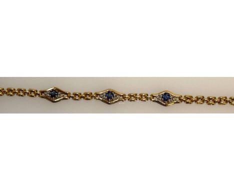 A good sapphire and diamond bracket, set in 9ct yellow gold with three sapphires and diamonds.