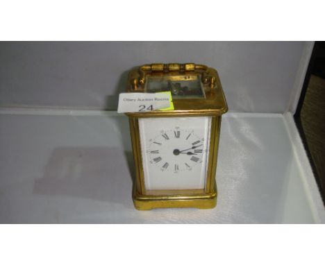 Early 20th century brass ormolu carriage clock with Arabic numeral outer chapter ring and Roman numeral inner ring 