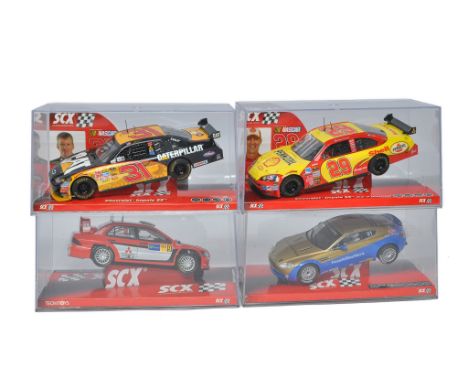 SCX slot car issues comprising 64220 Chevrolet Impala SS 'Caterpillar, 63380 Chevrolet Impala SS 'Harvick', 64530 Aston Marti