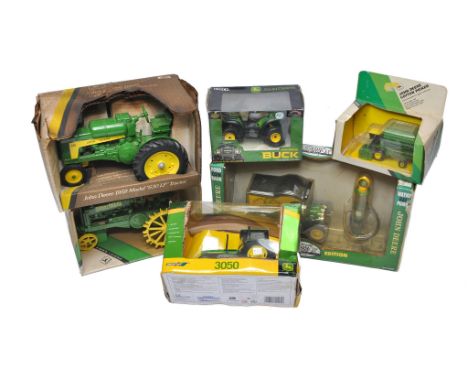 A group of Ertl 1/16 farm models including John Deere issues, plus Britains John Deere 3050 Tractor. Contents generally witho
