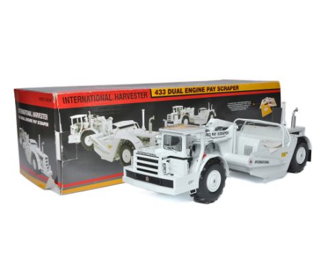 First Gear 1/25 diecast model construction issue comprising International Harvester Scraper (White Edition). Looks to be exce