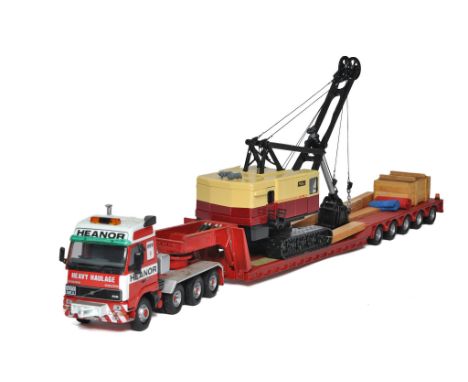 Corgi 1/50 diecast model truck issue comprising Volvo Low Loader with Excavator Load in the livery of Heanor Haulage. Some mi