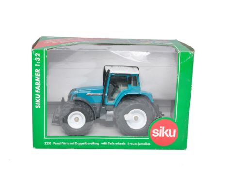 Siku 1/32 diecast farm model issue comprising Fendt 711 Vario Tractor. Limited Edition Petrol Double Wheel Variant. Looks to 