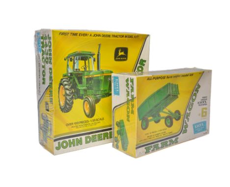 Ertl 1/25 plastic model kit comprising John Deere 4430 Tractor plus trailer. Sealed with wrapper. 