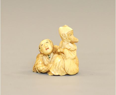 An ivory Netsuke of Hyakuzôsu with a hunter, by NaotsuguJapan, 19th centuryTwo characters of the Kyogen play Tsurigitsune, fo