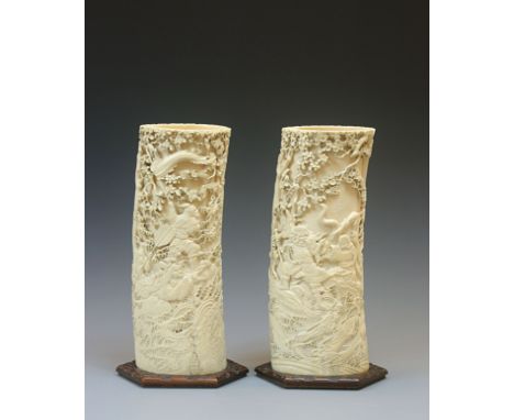 A Large pair of Japanese Ivory TusksJapan, Meiji period (1868-1912)Each carved in sunk relief with a continuous scenes from t