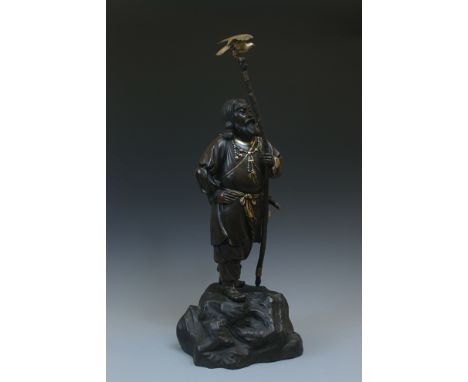 A mixed metal figure of Japans first Emperor JimmuJapan, Meiji period (1868-1912)Cast standing on a large rock, carrying a sw