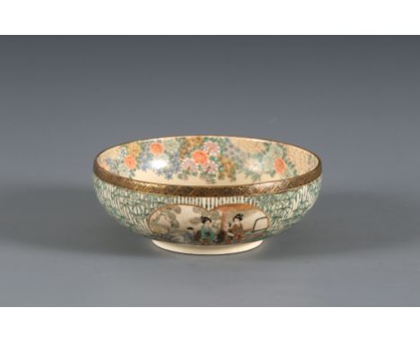 A Satsuma bowlJapan, Meiji period 19th centuryA shallow rounded bowl standing on a short footring, decorated with enamels and