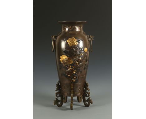 A heavy Japanese mixed metal sleeve vaseJapan, Meiji period (1868-1912) 19th centuryBaluster shaped vase standing on five scr