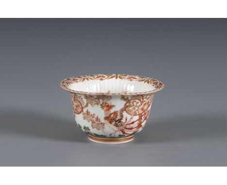 A gold Imari porcelain cup Japan, circa 1710-1730 With lobed rim and ribbed interior standing on a high footring, decorated i