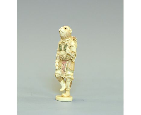 An ivory Netsuke of SongokuJapan, Meiji period (1868-1912)A finely carved standing figure of a monkey, dressed in Chinese arm