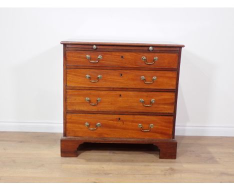 A George III mahogany Batchelor's Chest with moulded top above brushing slide and four graduated drawers mounted on bracket f