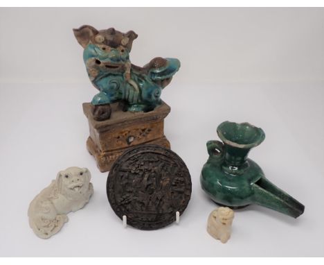 A Chinese pottery Dog of Fo and ball on plinth, 7in high A/F, a small ceramic recumbent Dog of Fo, 3 1/4in wide, a green glaz