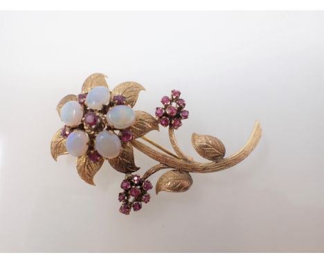 A Ruby and Opal Flower Spray Brooch claw-set five oval opal cabochons interspersed with round rubies, approx 6cms long, appro