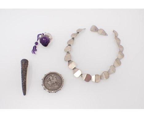 A Chinese silver Finger Nail Shield, a purple hardstone  Netsuke carved rat on fruit, an 1821 Crown etc 