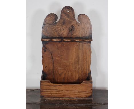 An elm Spoon Rack with shaped surmount above divisions and tray base, 12in W x 21in H 