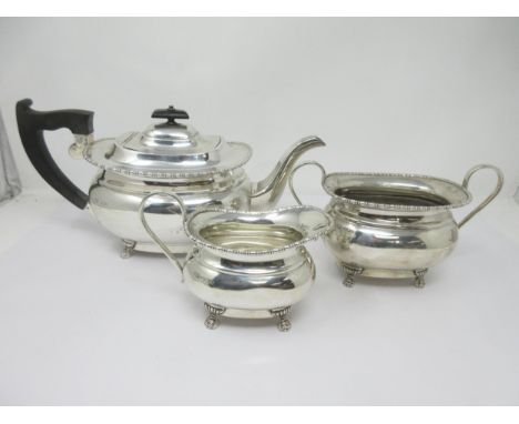 A George VI silver three-piece Tea Service of boat shape with bobbin borders on paw feet, Sheffield 1940, 1470gms all in 