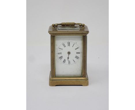 A small French brass Carriage Clock, the white enamel dial marked with Roman numerals, 3½in H 