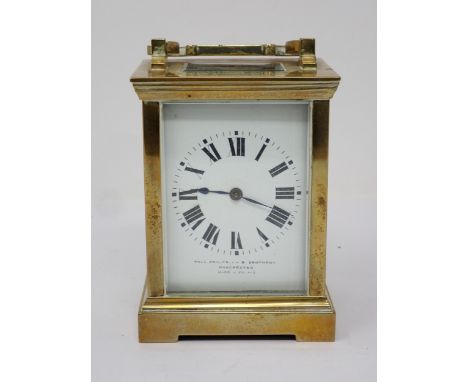 A brass cased Carriage Clock, with presentation inscription to the top, the white enamel dial inscribed Thos. Armstrong & Bro