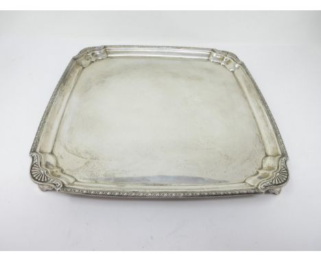 A George V silver square Salver with inverted gadroon corners on bracket feet, Sheffield 1930, 10 1/2in, 758gms 