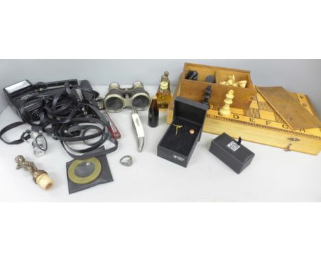 A collection of assorted items including a pair of leather covered binoculars, Agfa camera flashes, cufflinks, penknives incl