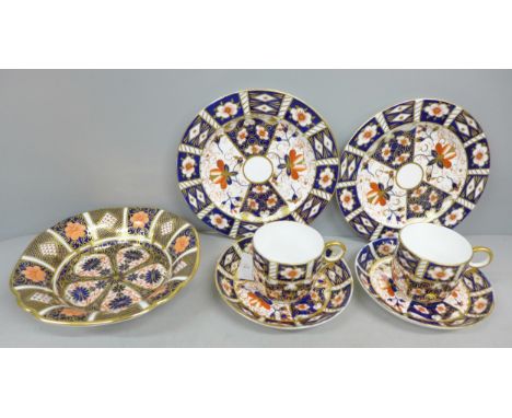 Two Royal Crown Derby Imari pattern trios, both having teacups, saucers and side plates, together with Royal Crown Derby bowl