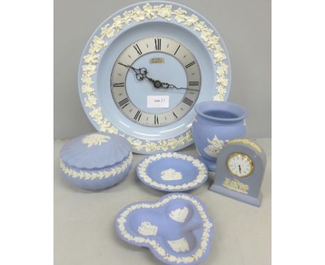 A collection of Wedgwood Jasperware comprising of a wall clock, vase, lidded pot, small mantel clock and other small dishes  