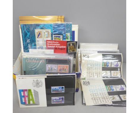 Stamps; a box of Great Britain presentation packs, pre and post decimal, including post and go packs