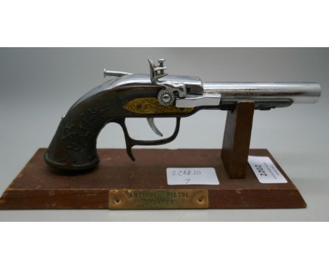 A novelty table lighter in the form of a pistol, with base  *THIS LOT IS NOT AVAILABLE FOR PACKING AND POSTING