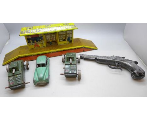 A collection of tin-plate cars and accessories including Pocket Toy/Brim-Toy, two Arnold tanks, a/f, and a Lone Star pistol  