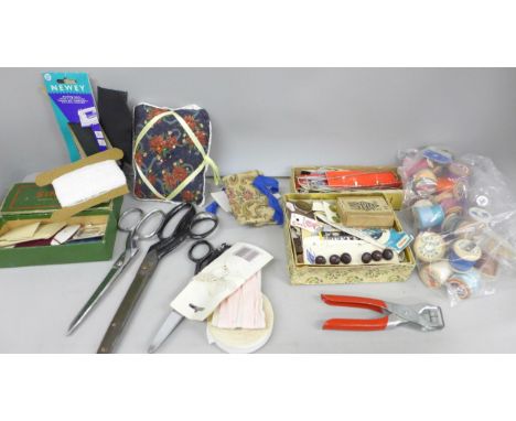 A collection of vintage haberdashery items including tailors scissors, buttons and ribbons, lace, etc.