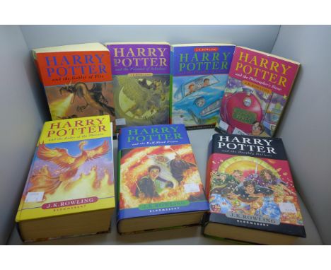 Seven Harry Potter books including three first edition hardback copies 
