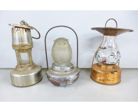 A novelty owl lantern together with two other lanterns 