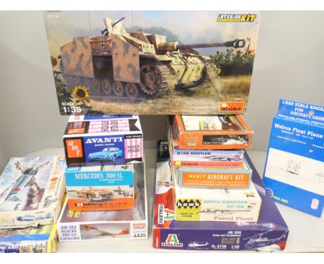 A collection of model aircraft, cars, etc., including MiniArt, Italeri, Hubley and Revell, (not started, some with sealed con