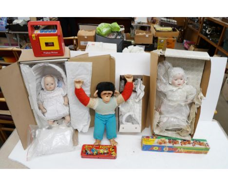 Box of assorted items to include doll, monkey toy, Fisher-Price cassette player, The Sooty Pixie Xylophone and more.