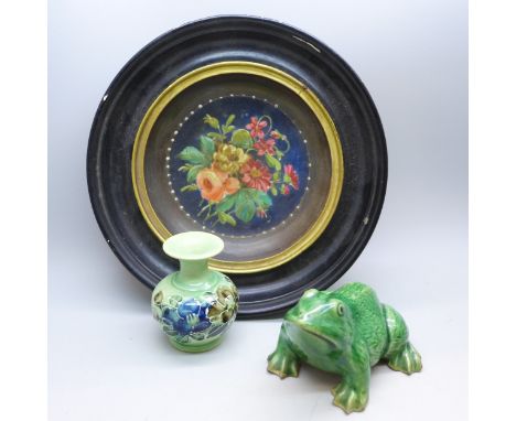 A ceramic frog with miniature floral vase and a framed plate with hand painted floral centre 