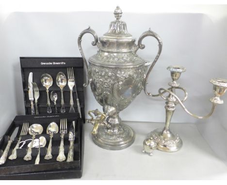 A collection of silver plate including a late 19th Century urn, a/f, a candlestick, and Grenadier Silversmiths flatware in fo