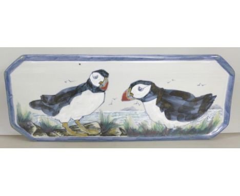 A Highland Stoneware platter with hand painted puffin design 