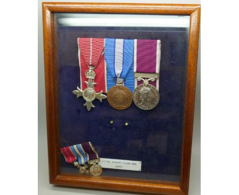 An MBE to Lt. Col. Albert Flear RAOC, mounted with UN and Regular Army Service medal, with miniatures and a Caverswall commem