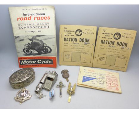 Two whistles, ration books, badges, a motorcycling programme, a box, etc.