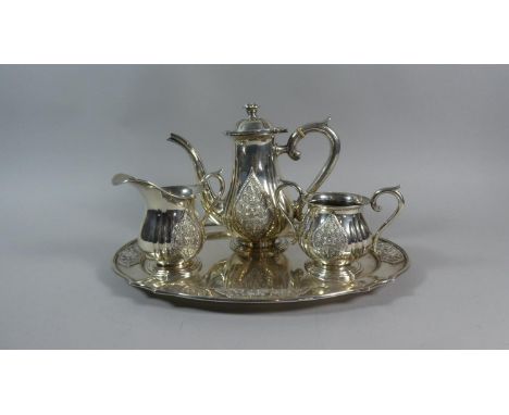 A Thai Silver Three Piece Tea Service on Matching Tray decorated in Relief with Seated Buddha. Teapot Lid Requires Re-Fixing 