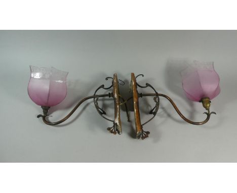 A Pair of Art Nouveau Pierced Copper Wall Light Brackets mounted on Wooden Supports. Both with Hexagonal Pink Glass Etched Sh
