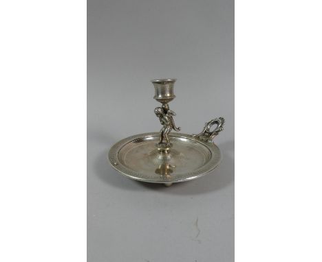 An Austro-Hungarian Silver Plated Figural Chamber Stick having Winged Cherub Support on Three Ball Feet. 15ms Diameter 