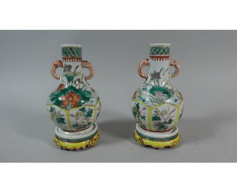 A Pair of Small Chinese Kangxi Bottle Vases in the Famille Verte Palette  with Ring Handles (15cms High) on Circular Glazed C