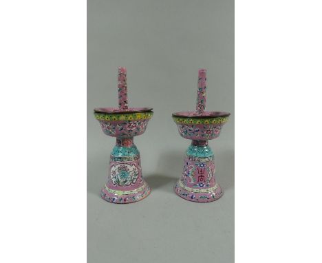 A Pair of Early Oriental Pink Enamel Metal Candlesticks/Incense Stick Holders decorated with Bats, Peaches, Flowers Etc. Each