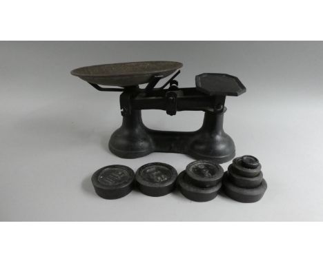 A Set of Vintage Kitchen Scales and Eight Weights