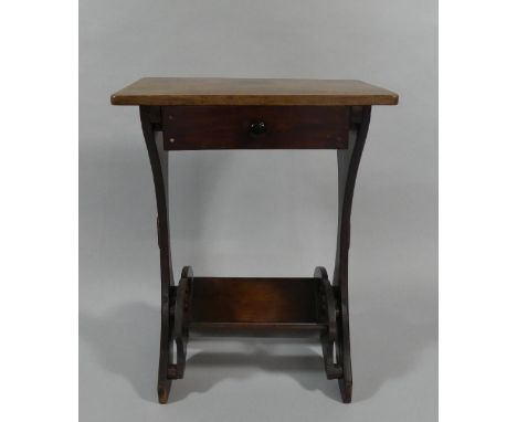 A Small Edwardian Side Table with Drawer and Book Trough Stretcher with Pierced Ends. 47cms Wide